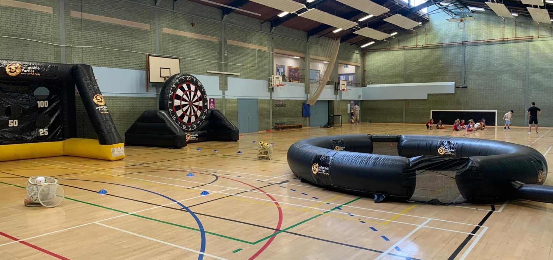 The inflatable pitch, football darts and target goal set up in a sports hall
